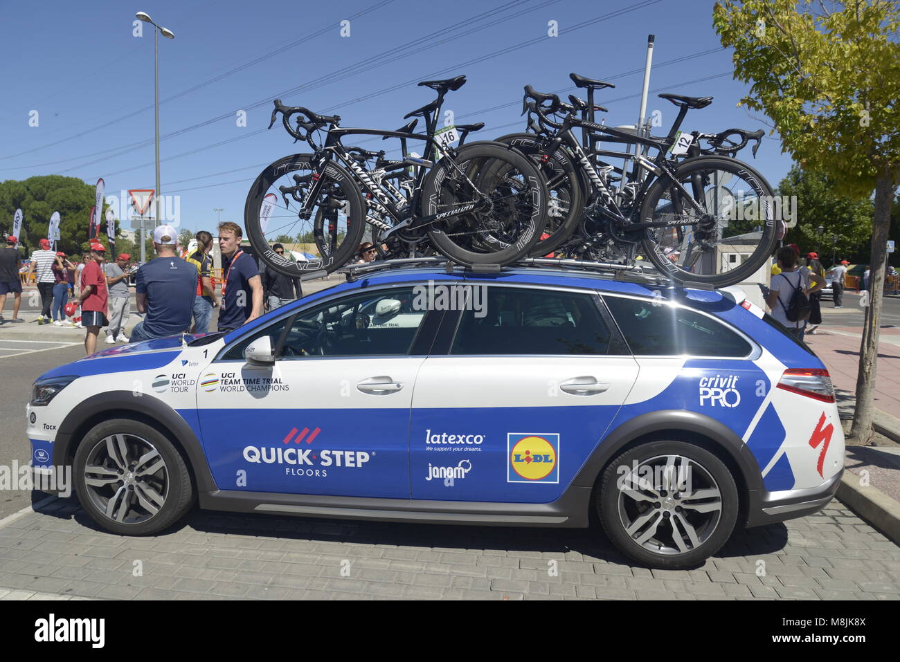 Quick Step cycling sports team support car used in la Vuelta holding spare road bicycles before stage departure in La Vuelta a España in Madrid, Spain Stock Photo