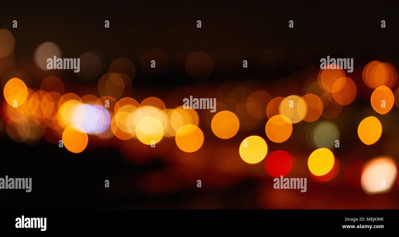 Abstract background with blurred lights at night in a city Stock Photo