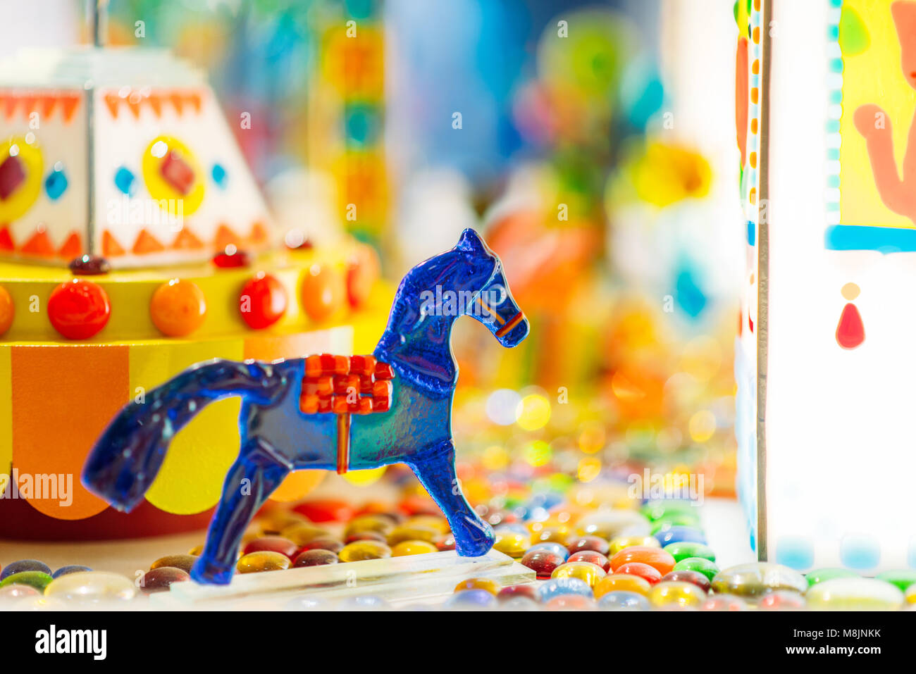 Handmade sugar caramel horse in showcase of candy store closeup, nobody