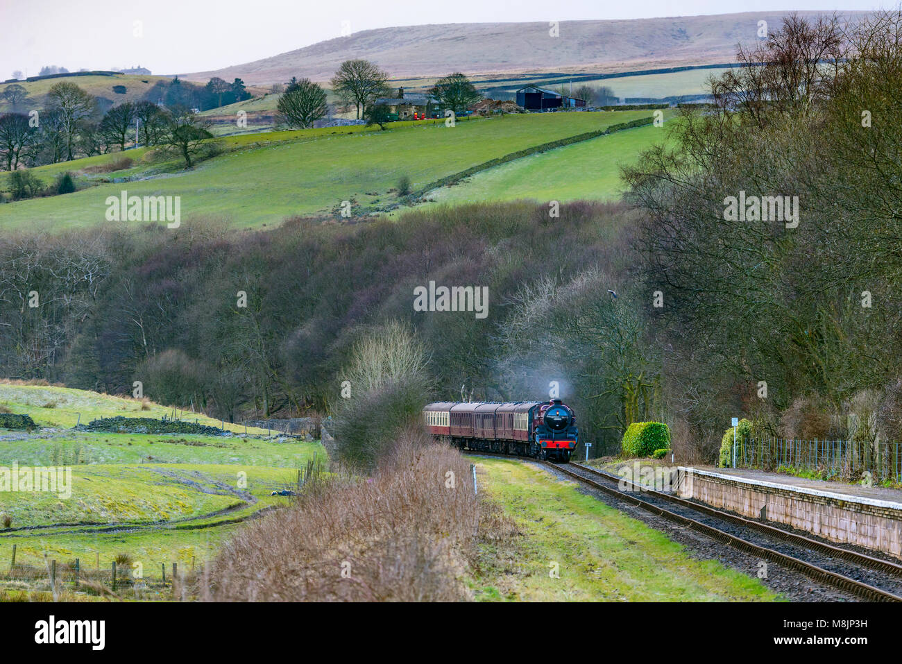 The Mogul steam locomotive The Crab pictured on the East Lancashire Railway At Irwell Vale halt. Stock Photo
