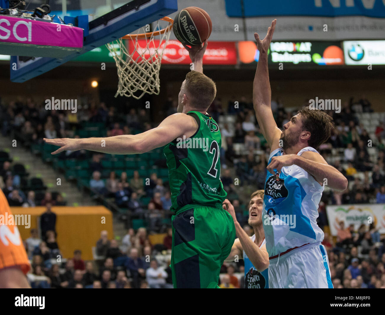 Badalona, Spain. 17th Mar, 2018. 17th March 2018; Tomasz Gielo, #21 of Divina Joventut in action with Nacho Llovet, #9 of Monbus Obradoiro during the 2017/2018 Liga ACB Endesa Round 23 game between Divina Joventut and Monbus Obradoiro at Pabellon Olimpico de Badalona on March 17, 2018 in Barcelona, Spain. Credit: Ukko Images/Pacific Press/Alamy Live News Stock Photo