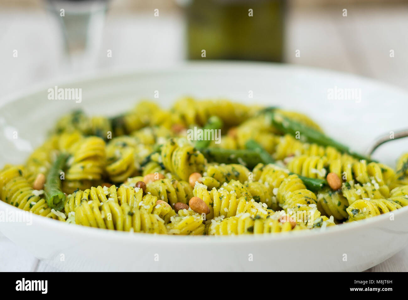Fresh fusilli with basil pesto with green beans,potatoes and pine nuts Stock Photo