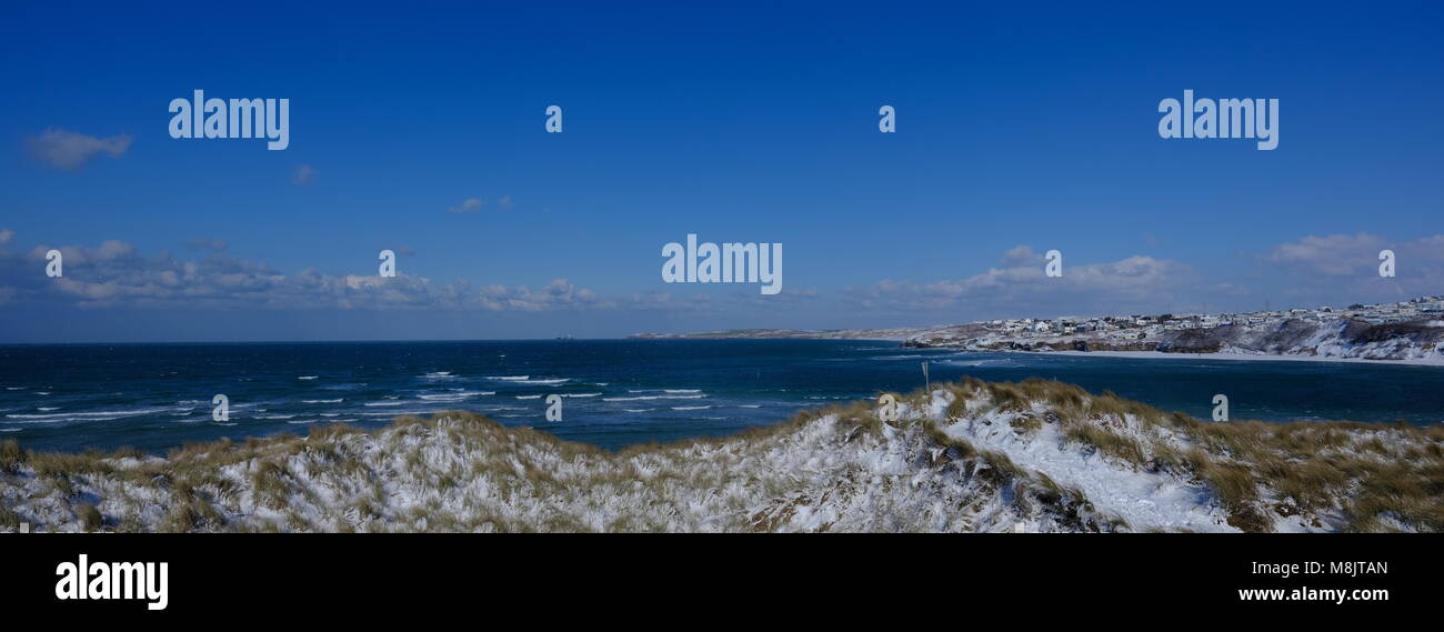 Porthkidney Beach Hayle Harbour and the dunes in the Snow Stock Photo