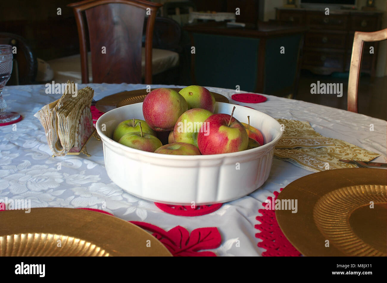 Red ripe apples on a table, room interior in the background Stock Photo ...