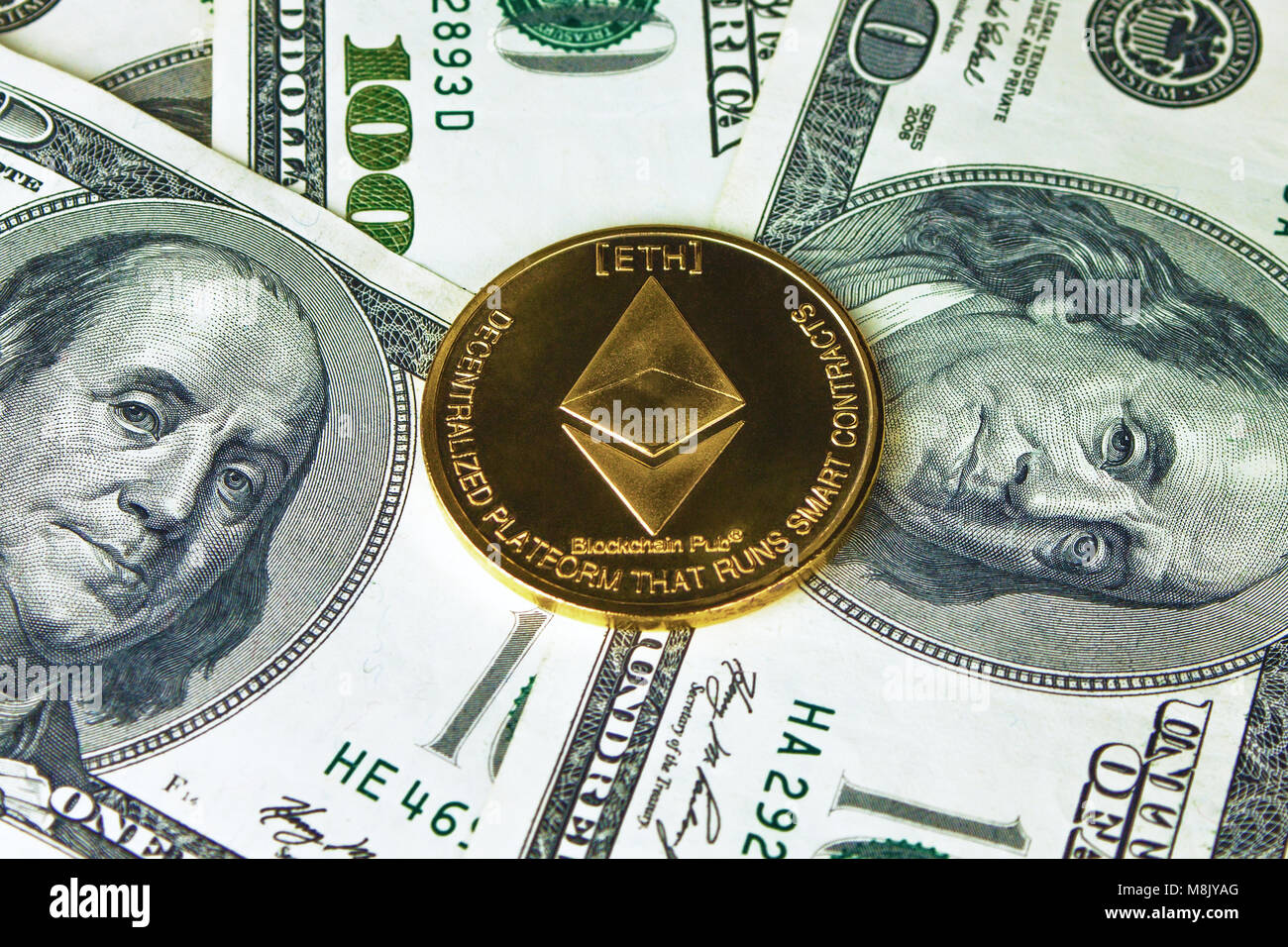 Ethereum and Callisto coins on dollar background. Stock Photo