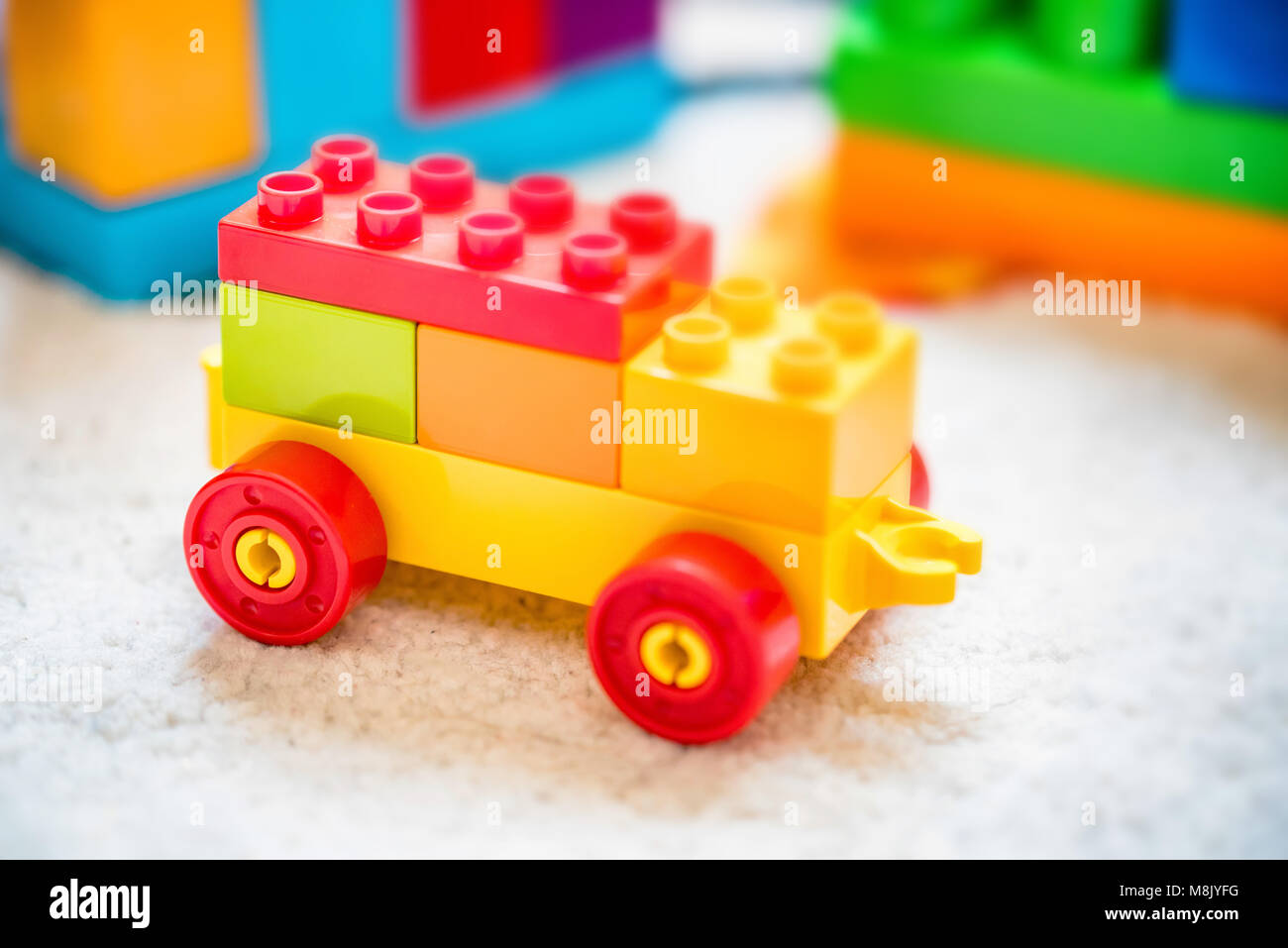 Plastic toy car made of building blocks Stock Photo