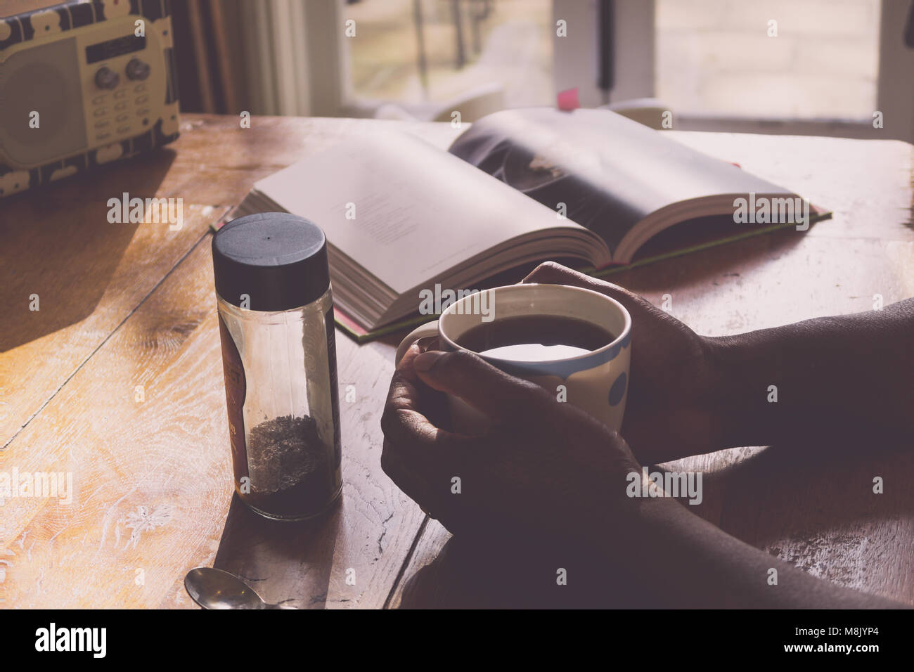 Drinking coffee in the kitchen Stock Photo