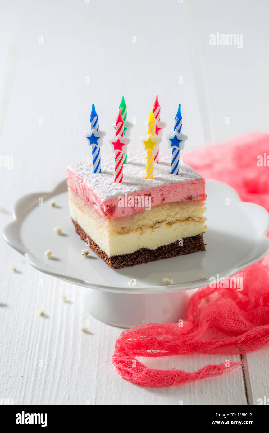 Tasty birthday cake with strawberry and candles Stock Photo - Alamy