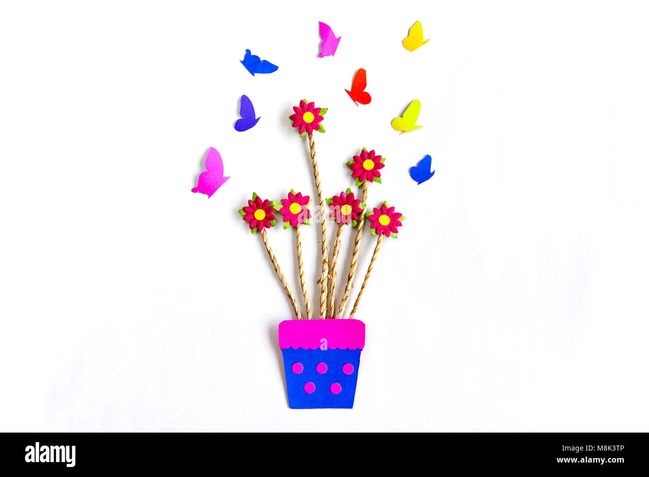 Color paper art, PInk flowers on a vase with butterfly on white background Stock Photo