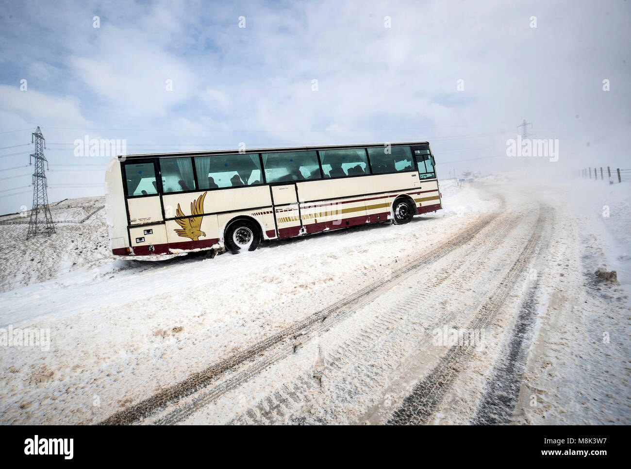 A stranded coach on Blackstone Edge near Littleborough in Greater Manchester where snow fell overnight as the wintry snap dubbed the 'mini beast from the east' keeps its grip on the UK. Stock Photo