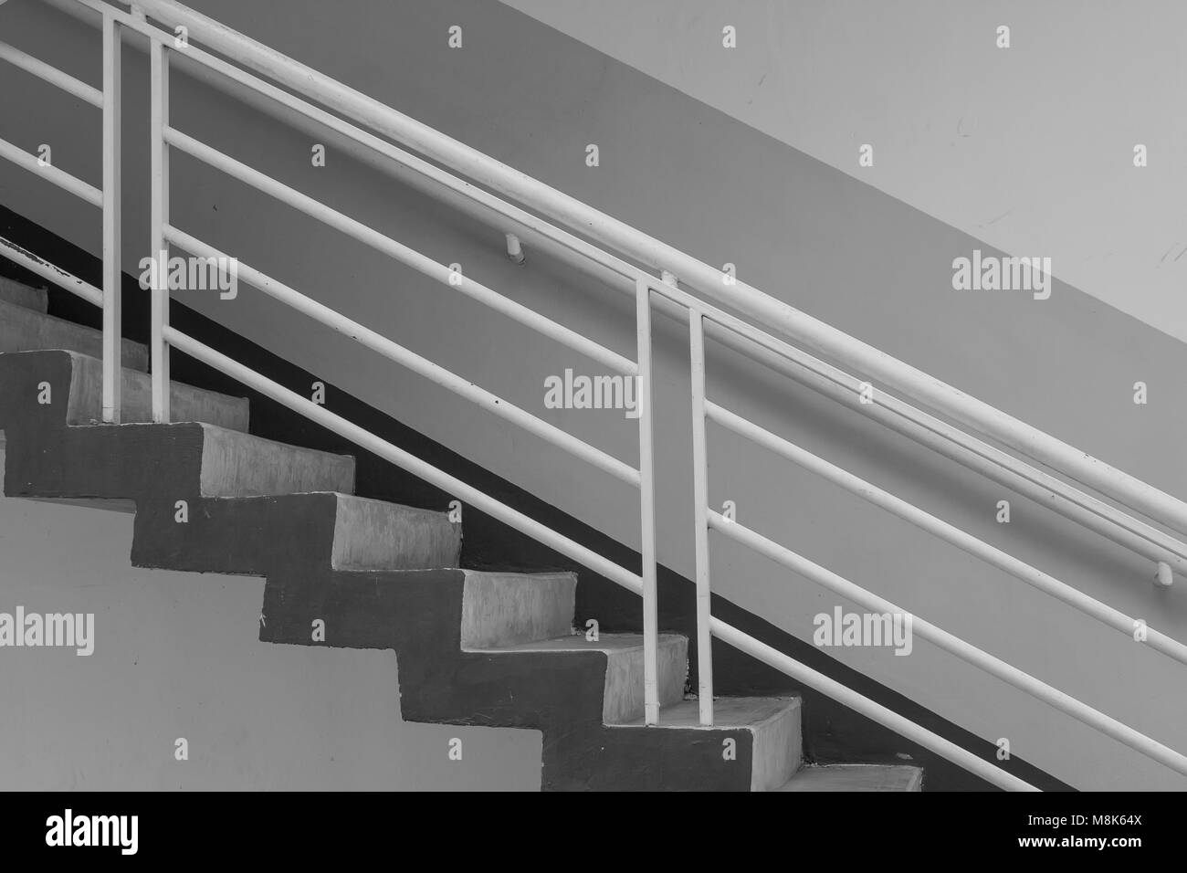 Abstract black and white image side view of architecture staircase outside of buildings. Stock Photo