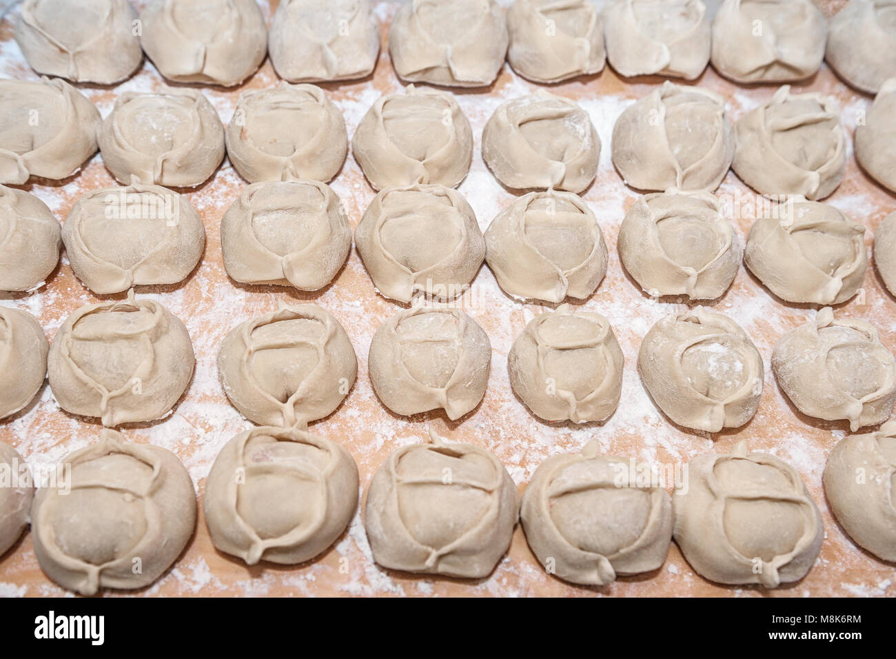 Kazakh or Uzbek homemade Manty on the table close-up. Background. Stock Photo