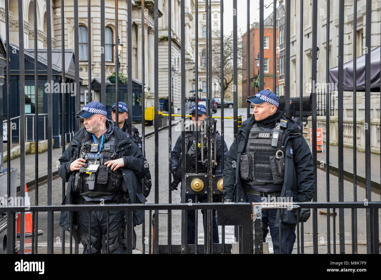 Heavy security presence in front of the Prime Minister's Office at 10 Downing Street in the City of Westminster, London, England, UK Stock Photo