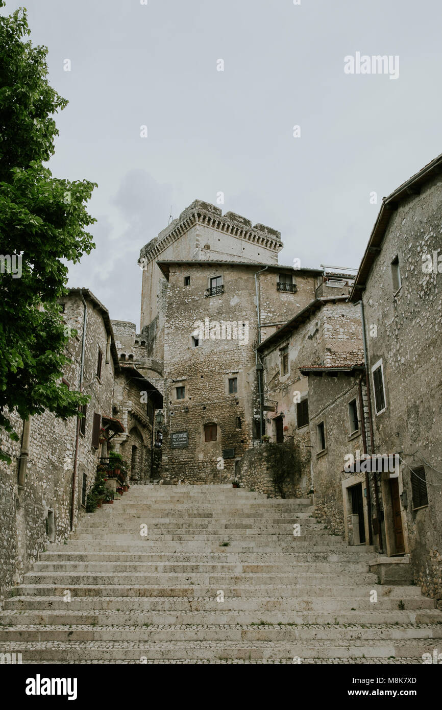 Via delle Scalette street of Sermoneta with view of the Castle Stock Photo