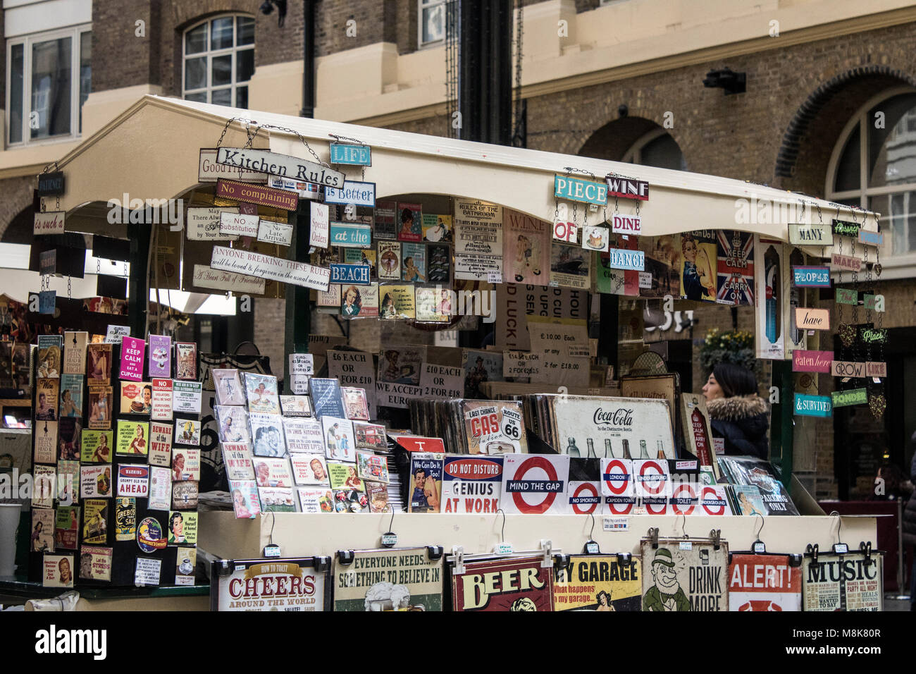 signs at hays galleria in london featuring shops, restaurants, cafe's and bars with stalls of gifts Stock Photo