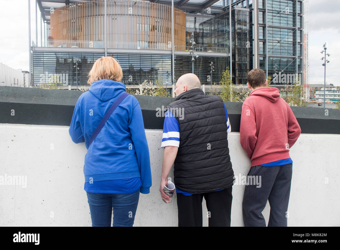 Everton football club fans wearing blue at Wembley Stadium in London Stock Photo