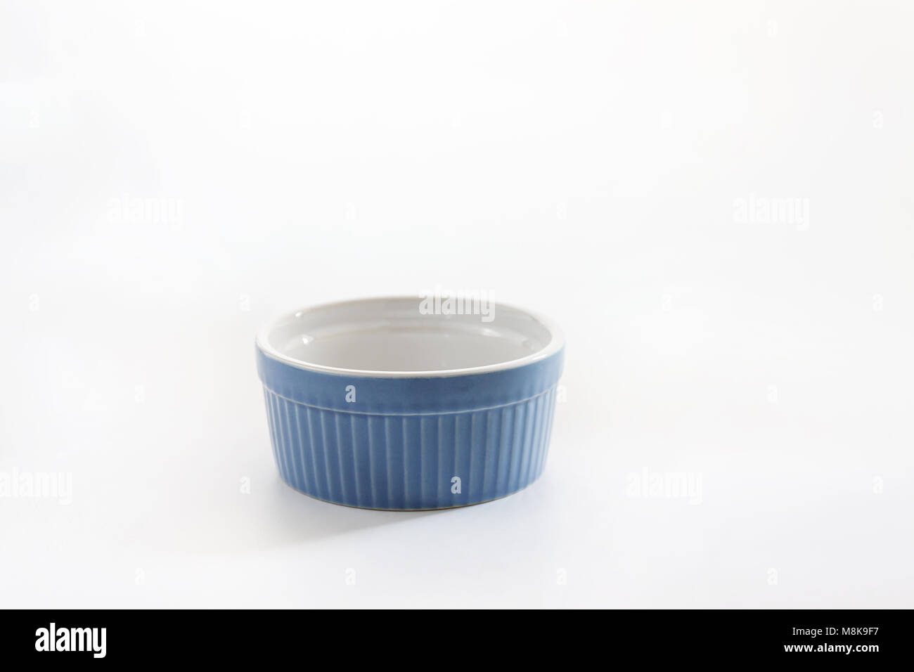 Porcelain souffle ramekin dish isolated on white background Stock Photo