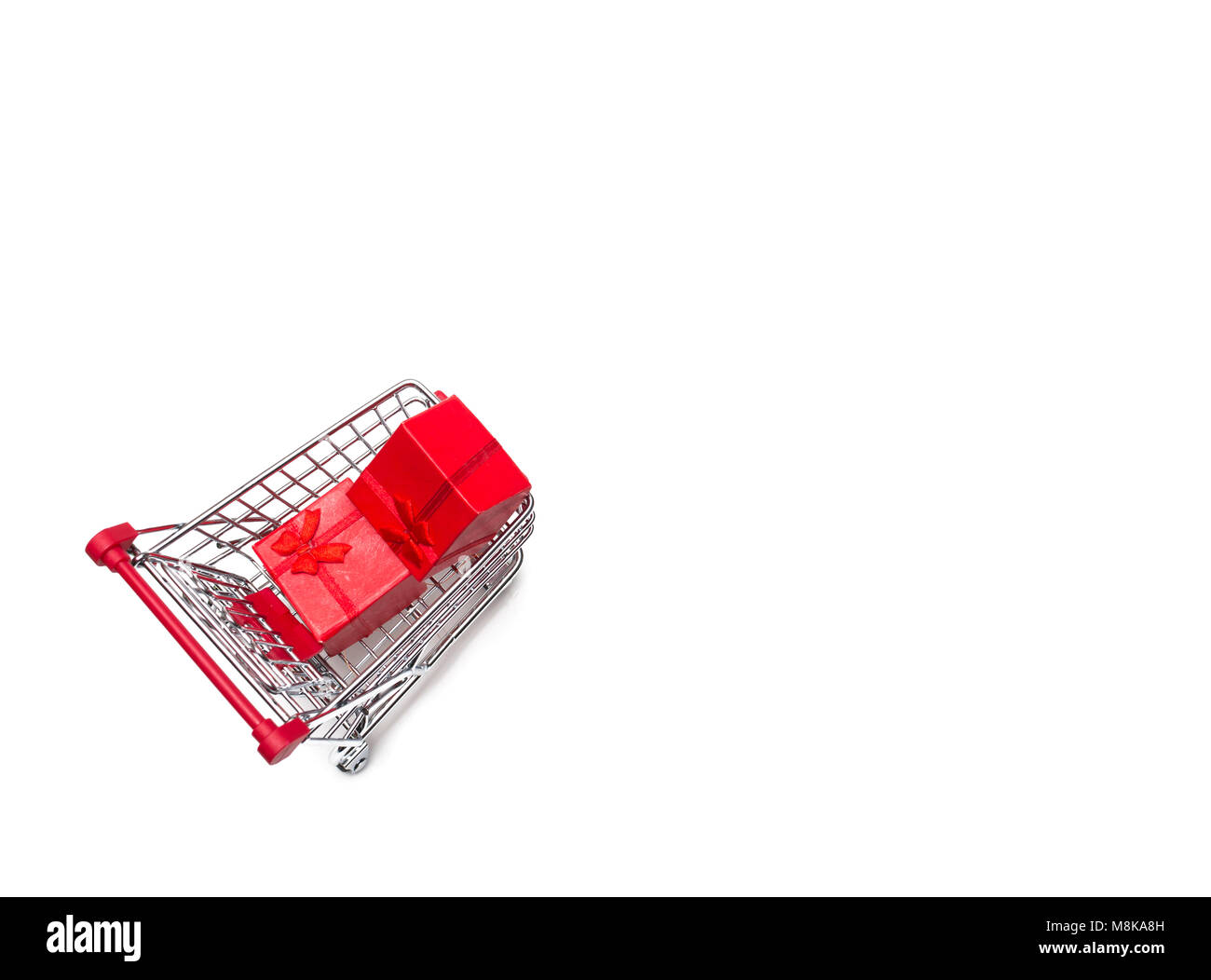 Buying a presents from supermarket, present in shopping cart, shoping cart isolated on white background Stock Photo