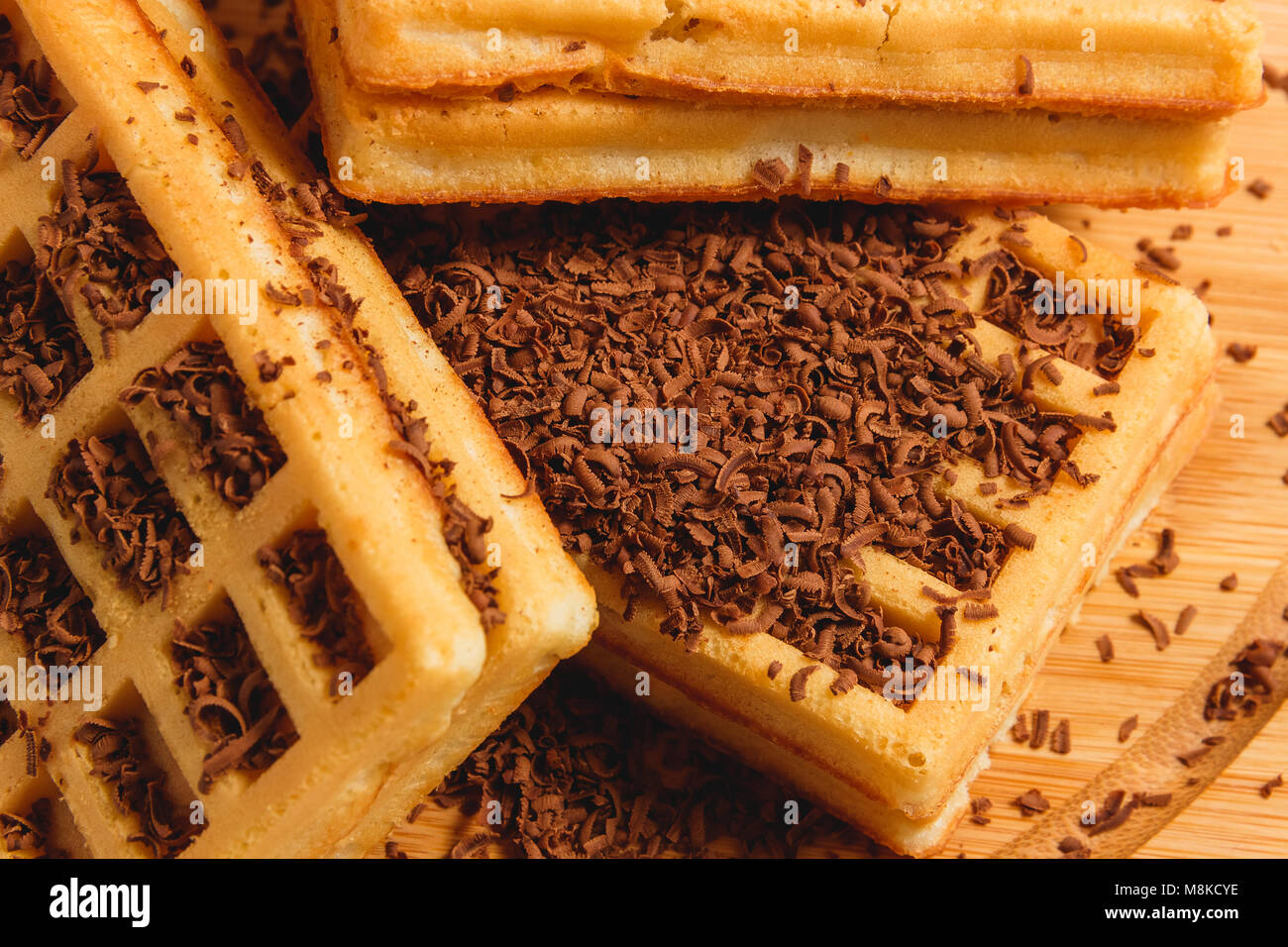 Homemade Waffles with Jam and Chocolate Shavings Background. Stock Photo