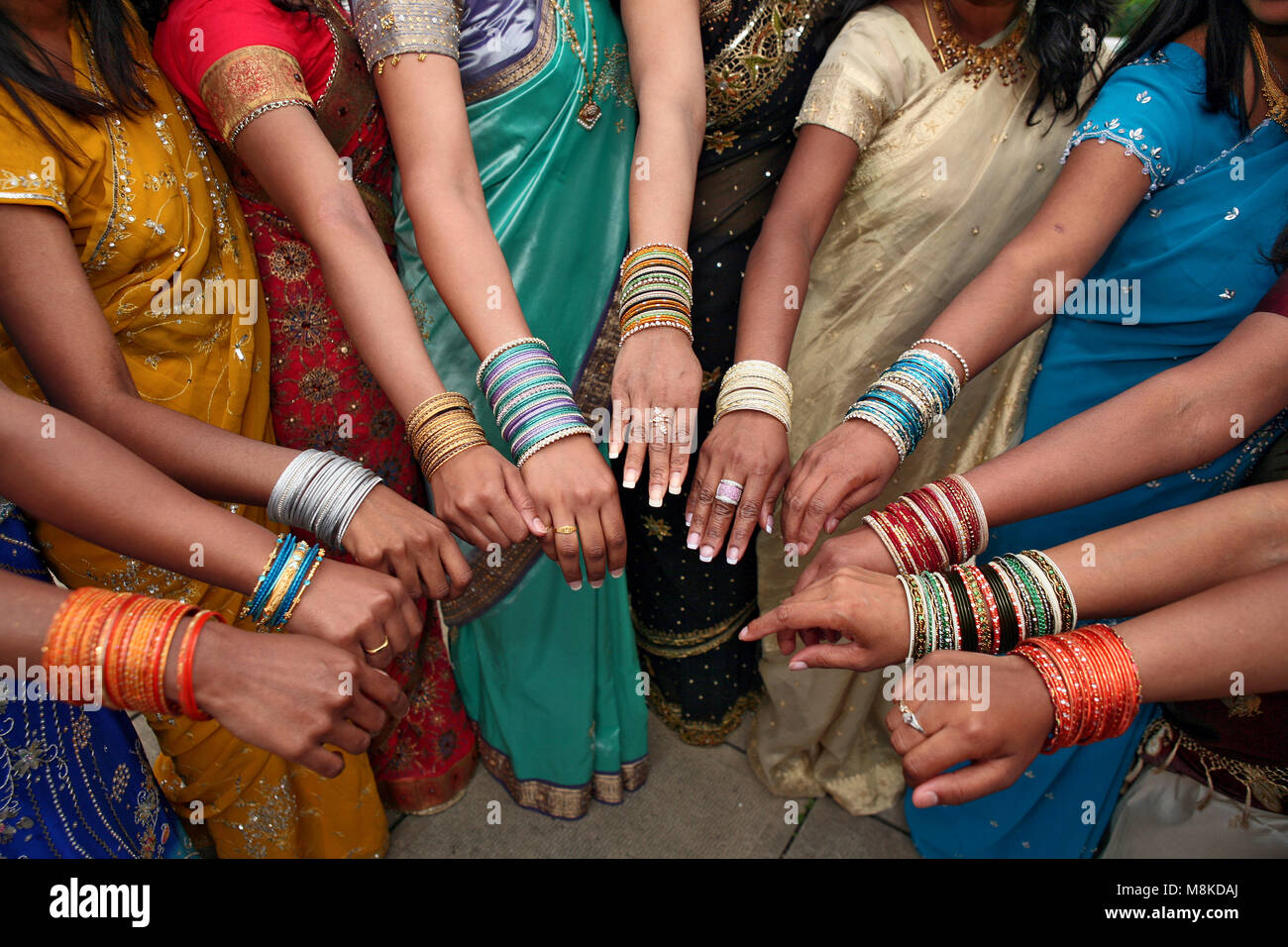 India women in colorful dresses and wrist jewelry Stock Photo