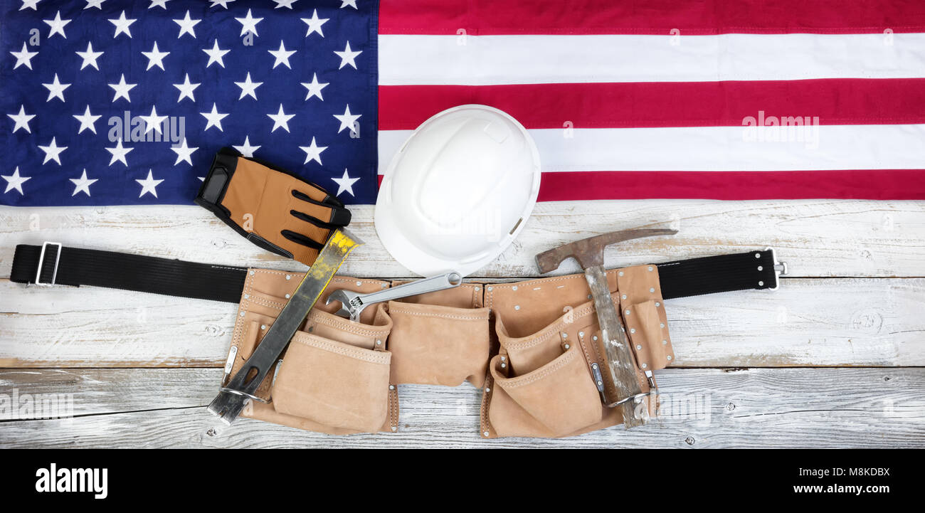 Red, white and blue American flag with industrial tools for Labor Day background Stock Photo