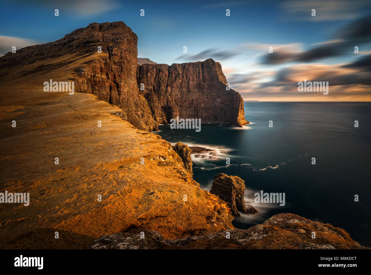 High cliffs of Vagar Island in sunset, Faroe Islands Stock Photo - Alamy