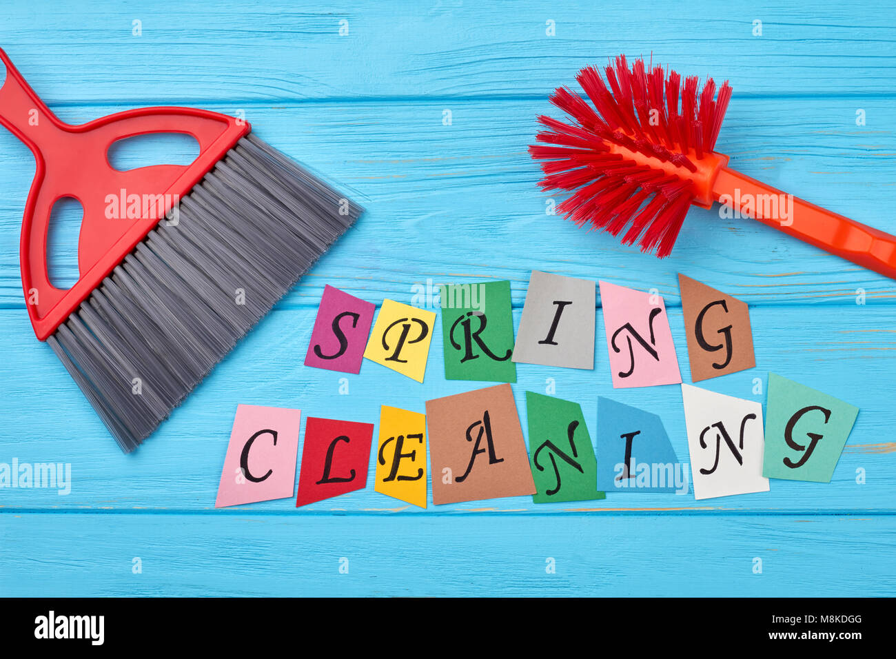 Brushes for house cleaning on wooden background Stock Photo - Alamy