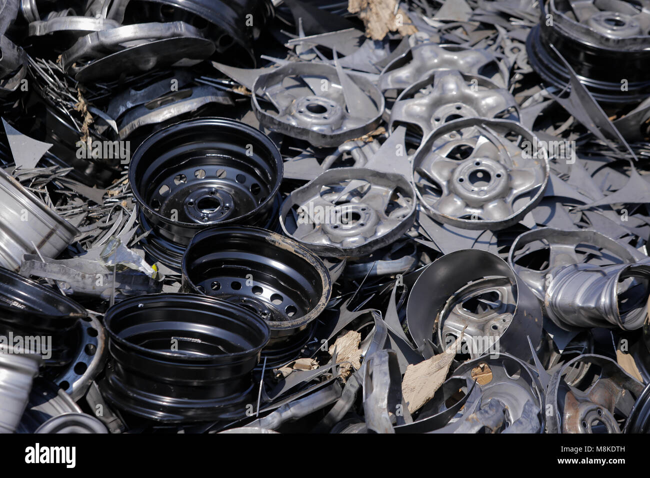 Old car rims at a scrapheap junkyard Stock Photo Alamy