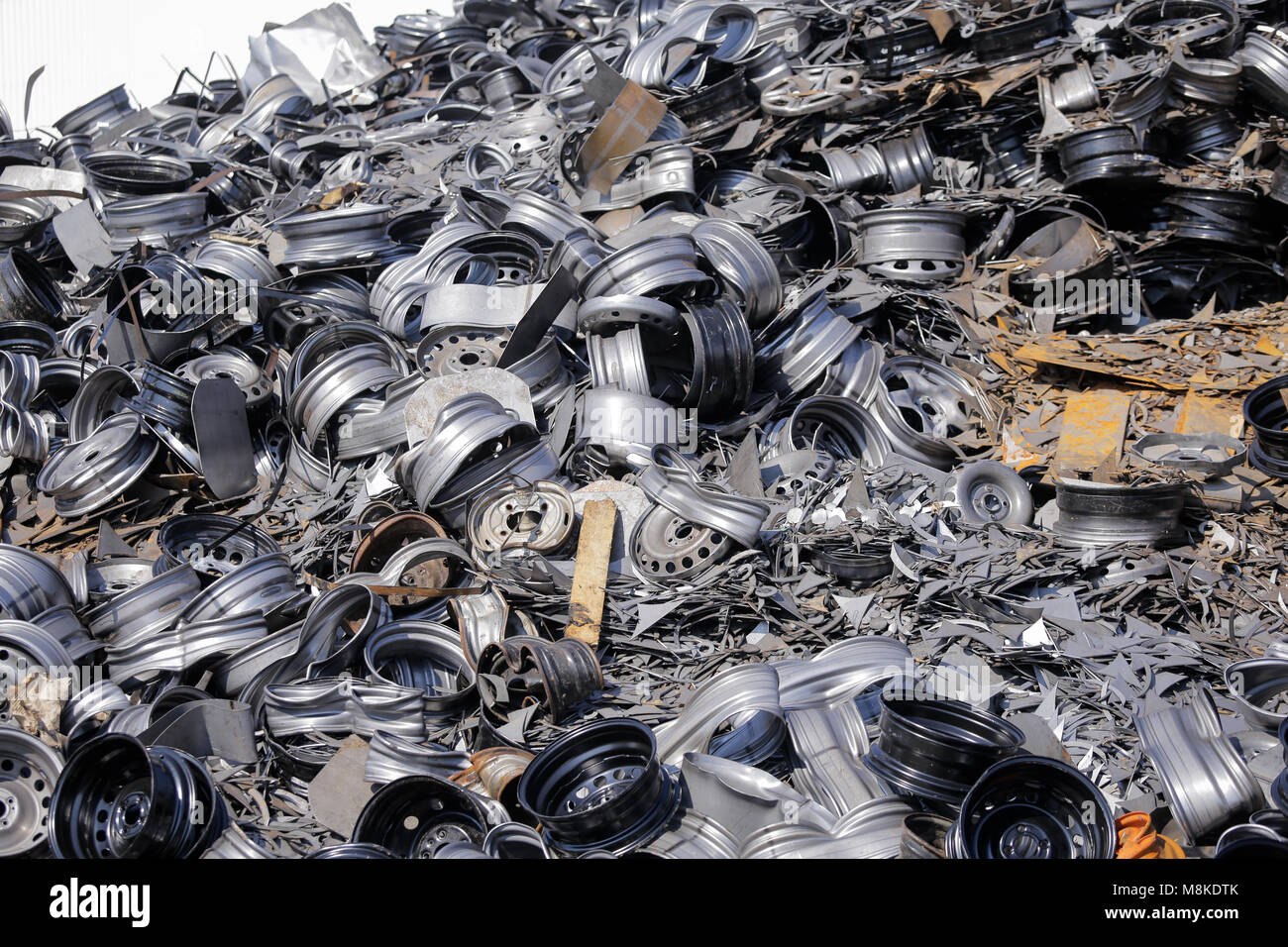 Old car rims at a scrapheap junkyard Stock Photo Alamy