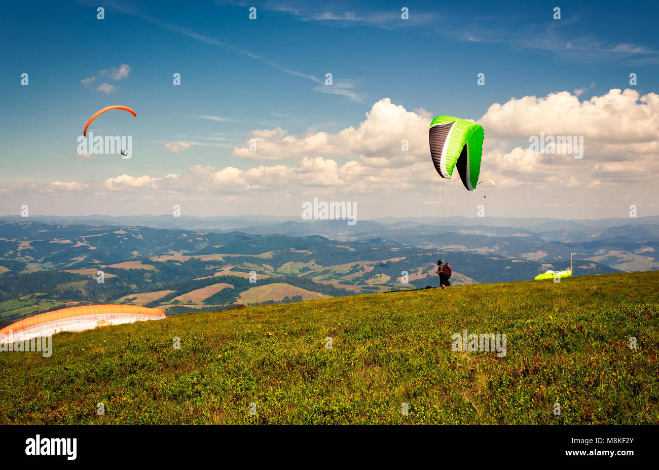 Skydiving  flying over the mountains. parachute extreme sport Stock Photo