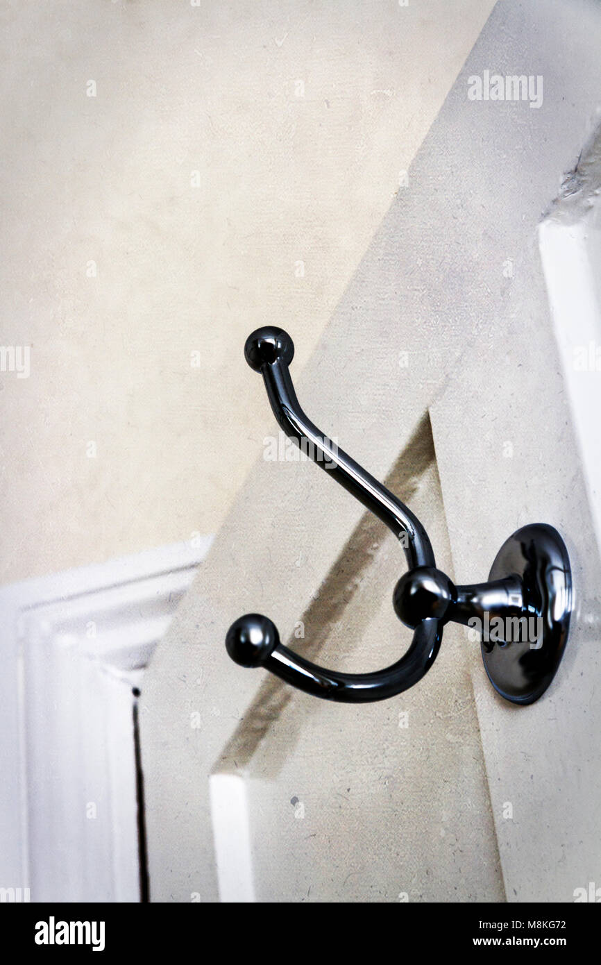 Coat hook on a door Stock Photo Alamy
