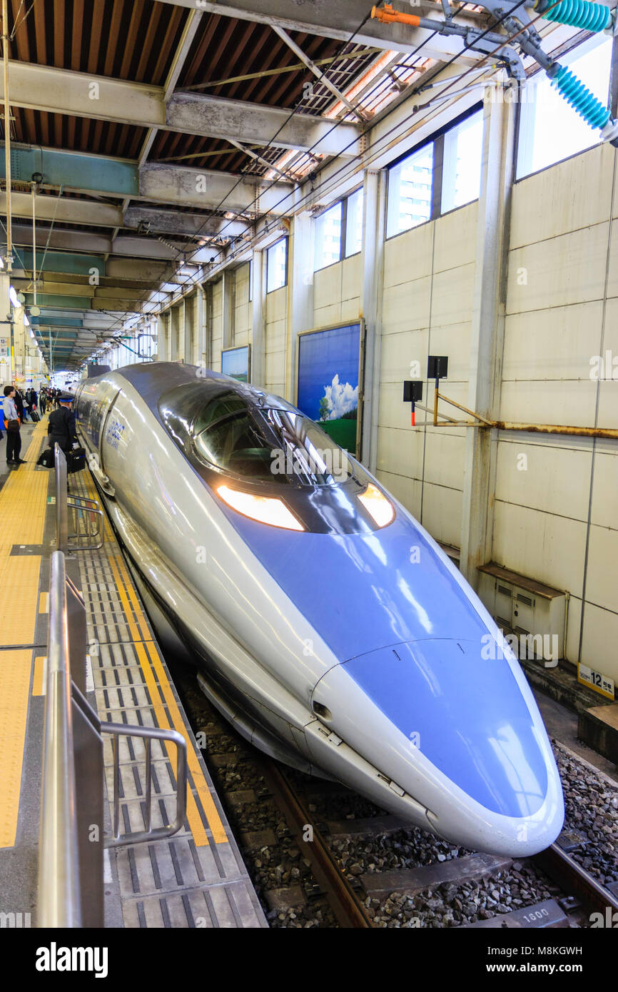 Japan, Hiroshima station. Shinkansen, blue and grey 500 series Kodoma bullet train at platform Japan, Hiroshima station. Shinkansen, blue and grey 500 series Kodoma bullet train at platform
