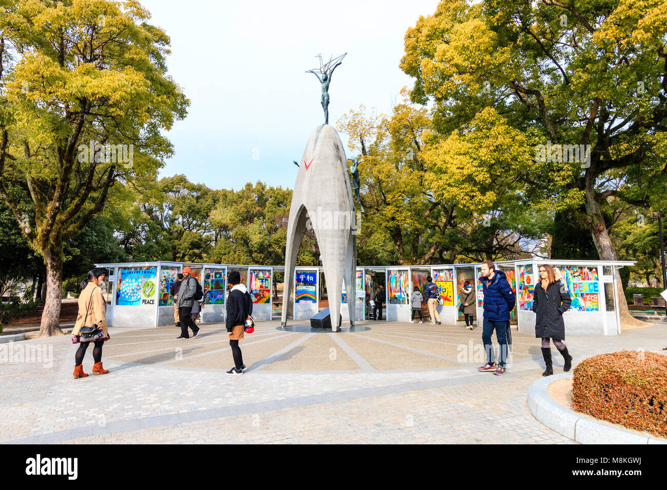 Japan, Hiroshima. People and tourists visiting the Children's Peace Memorial to commemorate Sadako Sasaki. Overcast weather. Stock Photo