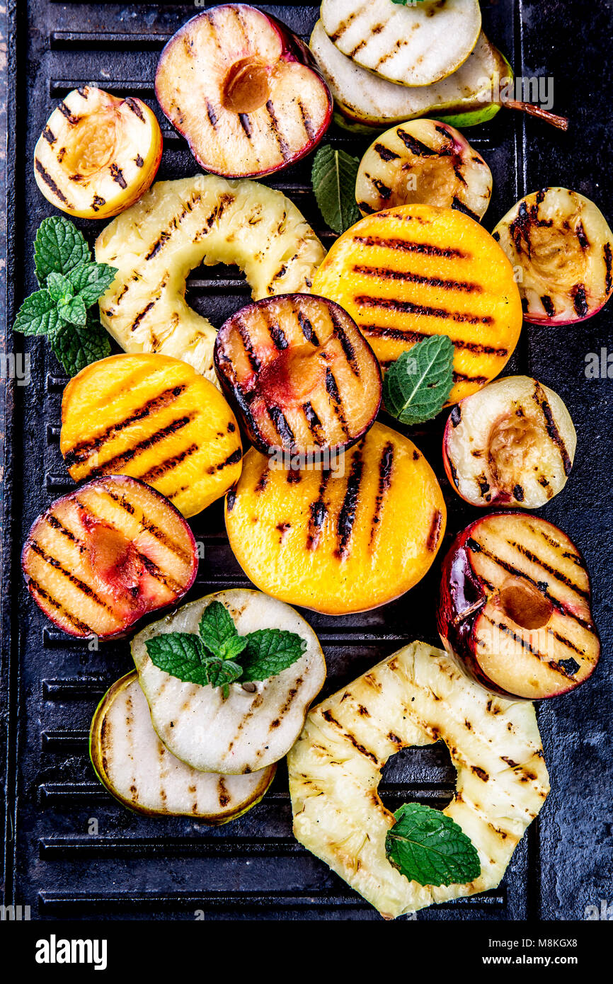 GRILLED FRUITS. Grill fruits pineapple, peaches, plums, avocado, pear