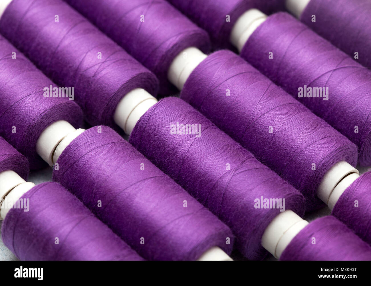 background thread spools purple, violet, lilac close-up Stock Photo