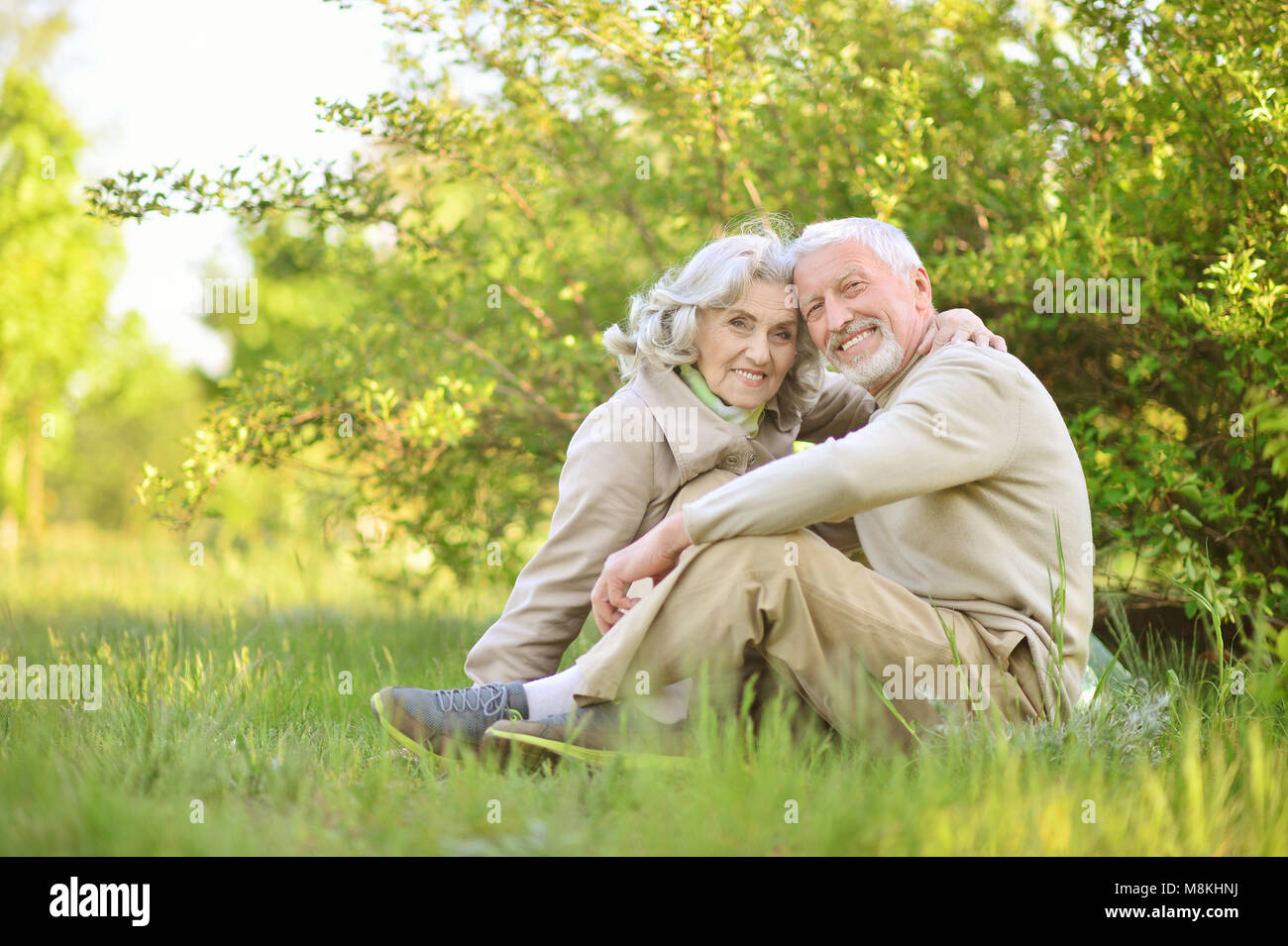 Happy couple hugging in spring park Stock Photo - Alamy