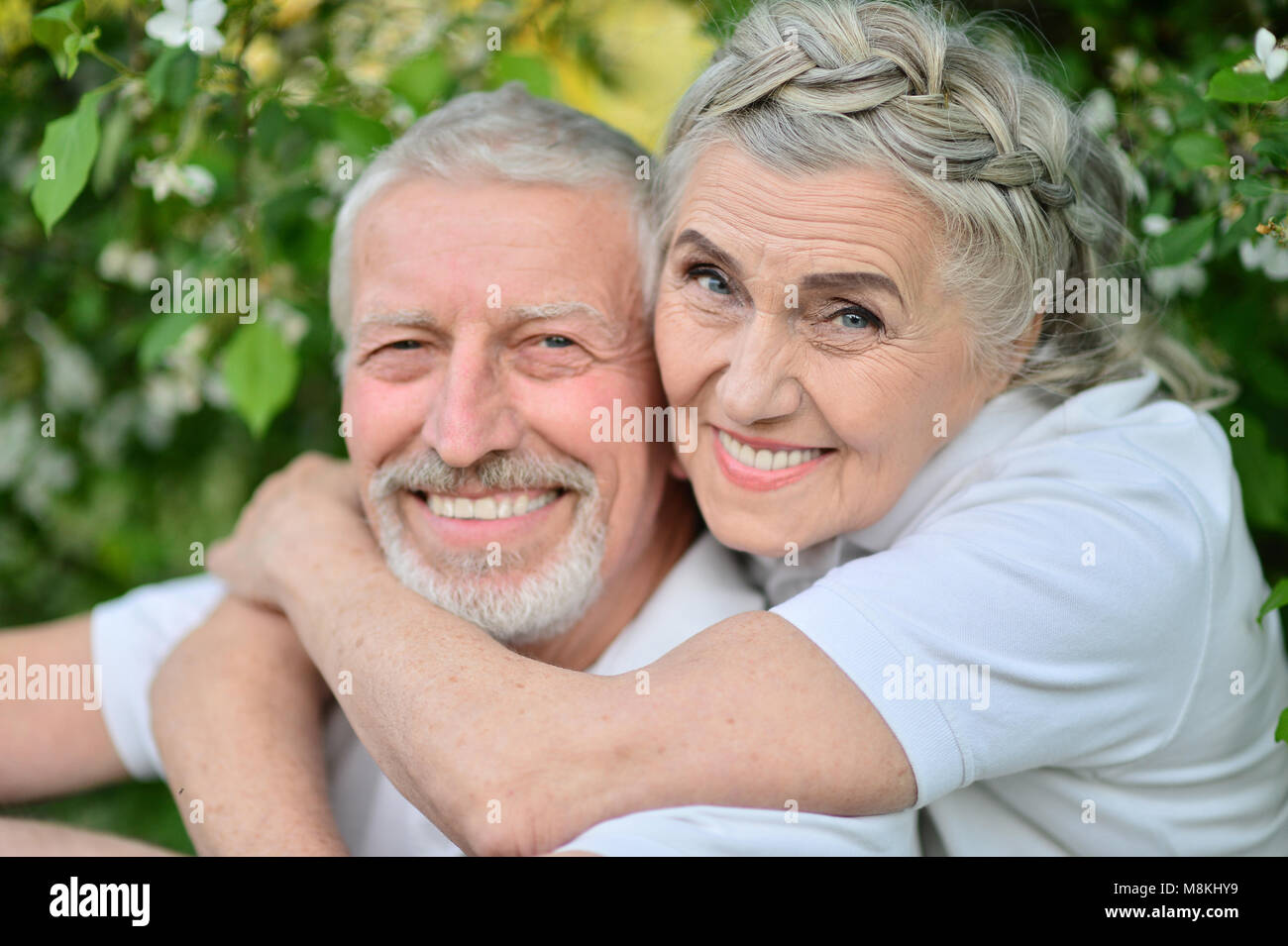Happy couple hugging in spring park Stock Photo - Alamy