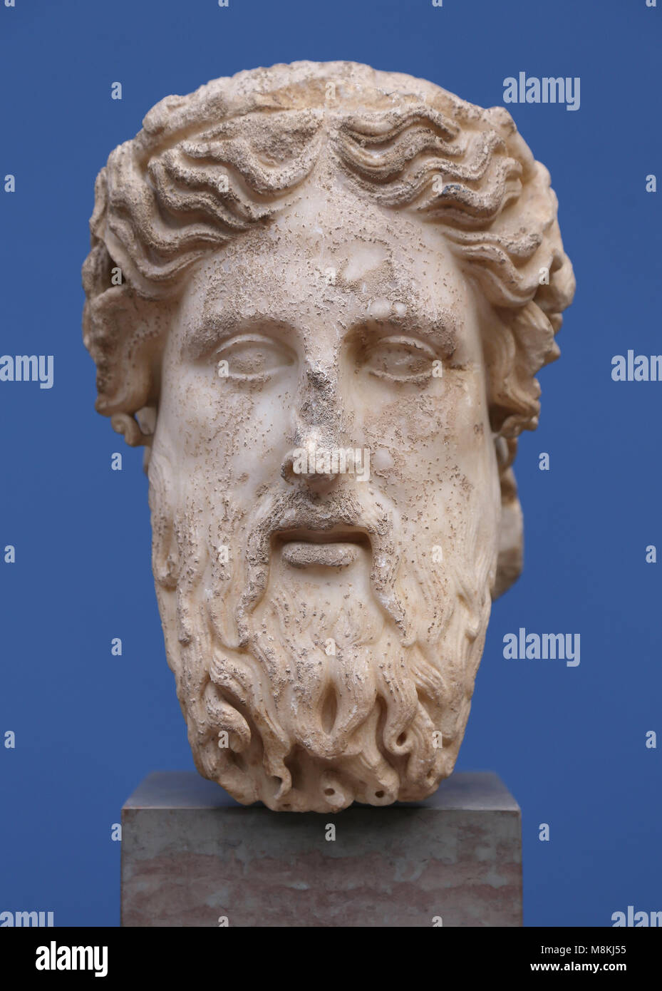 Bearded head of Hermes. Herm. Italy, 1st-3nd century AD. Marble. Greek god used as a marked boundaries or landmark. Stock Photo