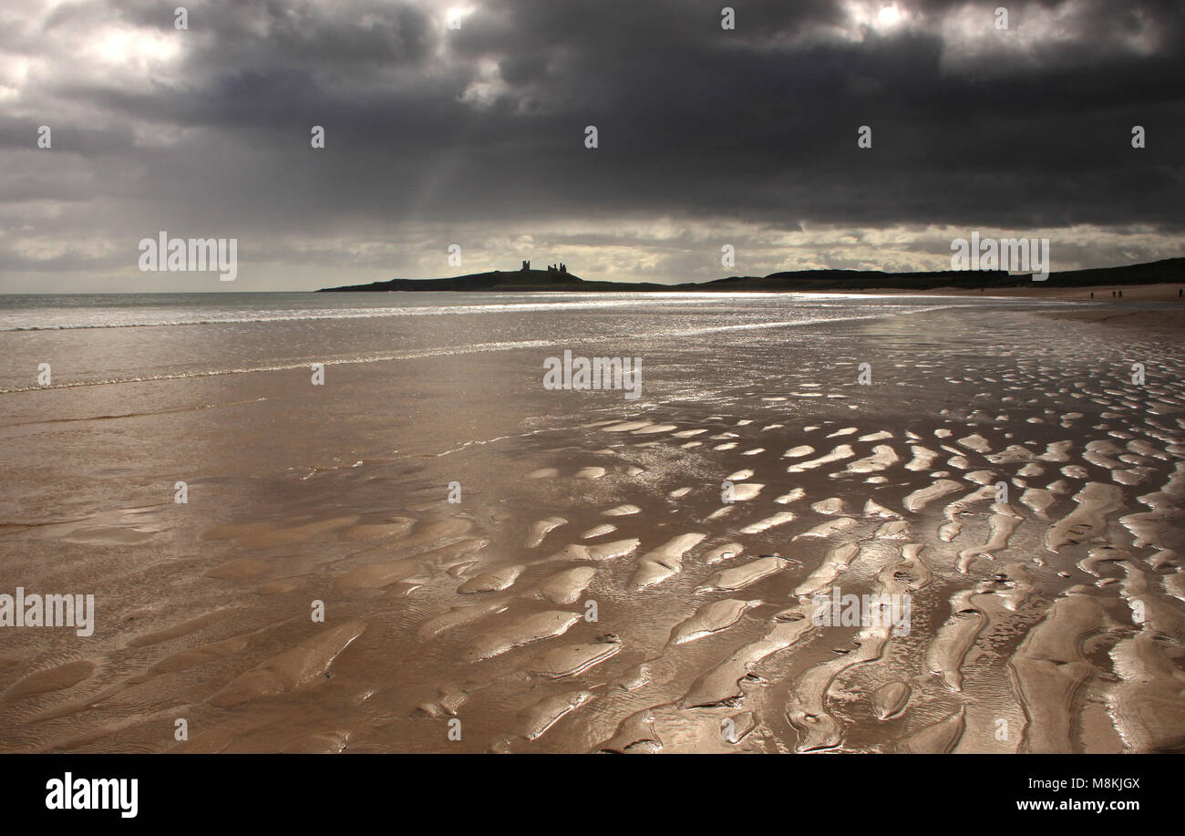 Dunstanburgh Castle & Embleton beach, Northumberland Stock Photo