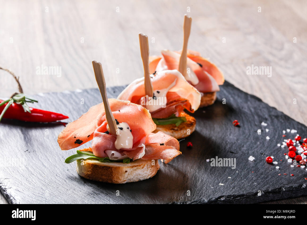 Bruschetta with hamon and sauce Stock Photo - Alamy