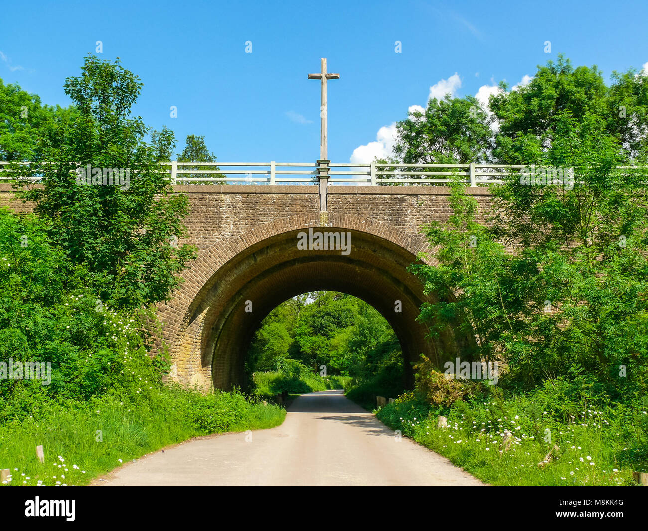 Bridge in Compton Surrey, designed by Edwin Lutyens with Cross of Sacrifice Stock Photo