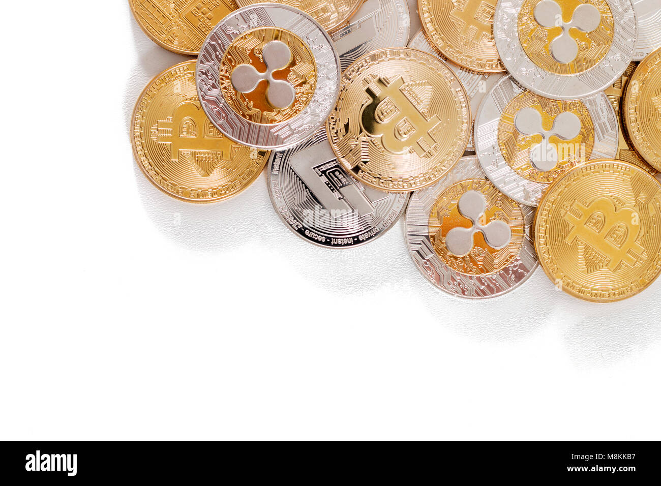 several aligned crypto currency coins on a white background Stock Photo ...