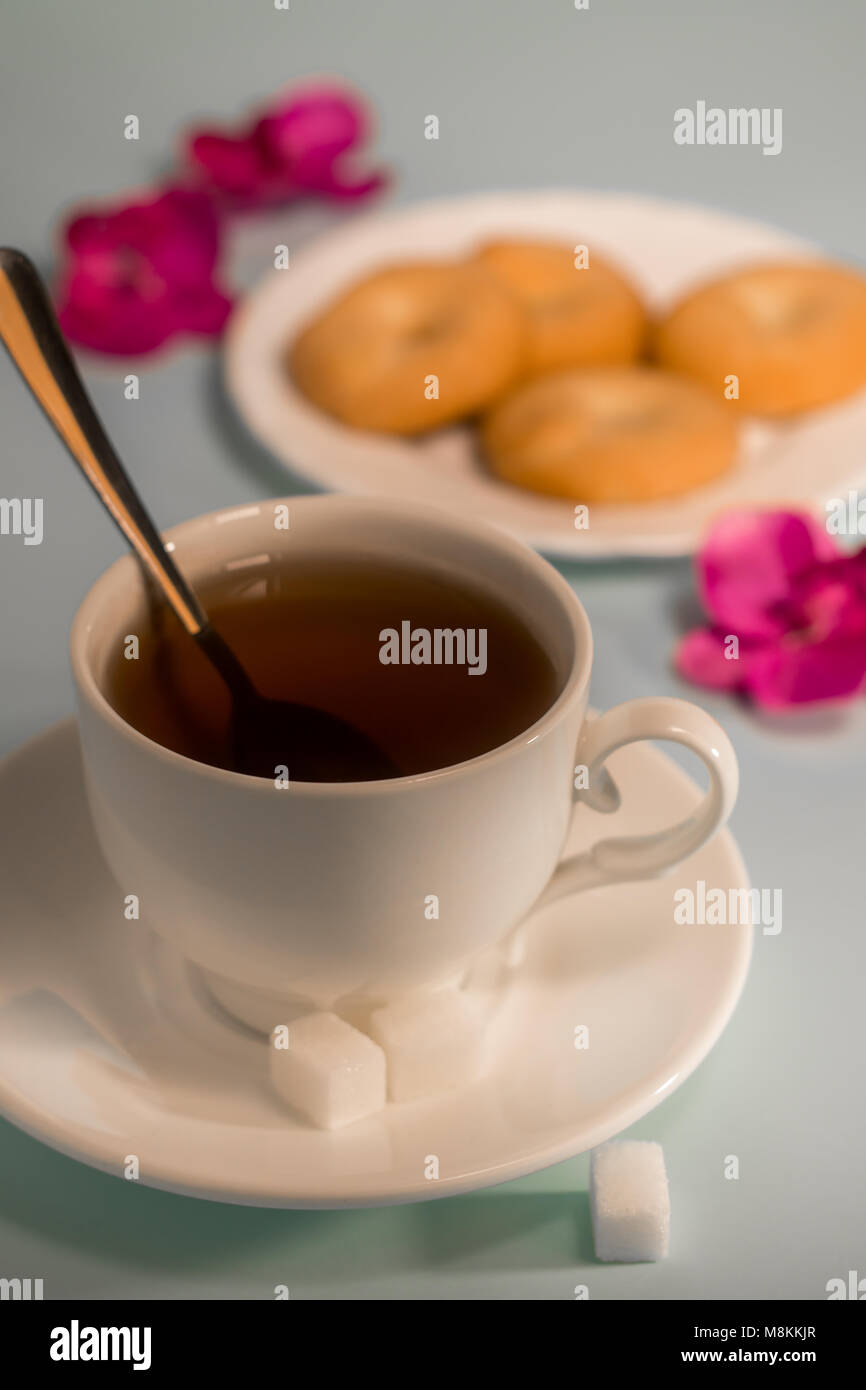 A cup of tea with biscuits. A cup of tea on the table. Tea with ...