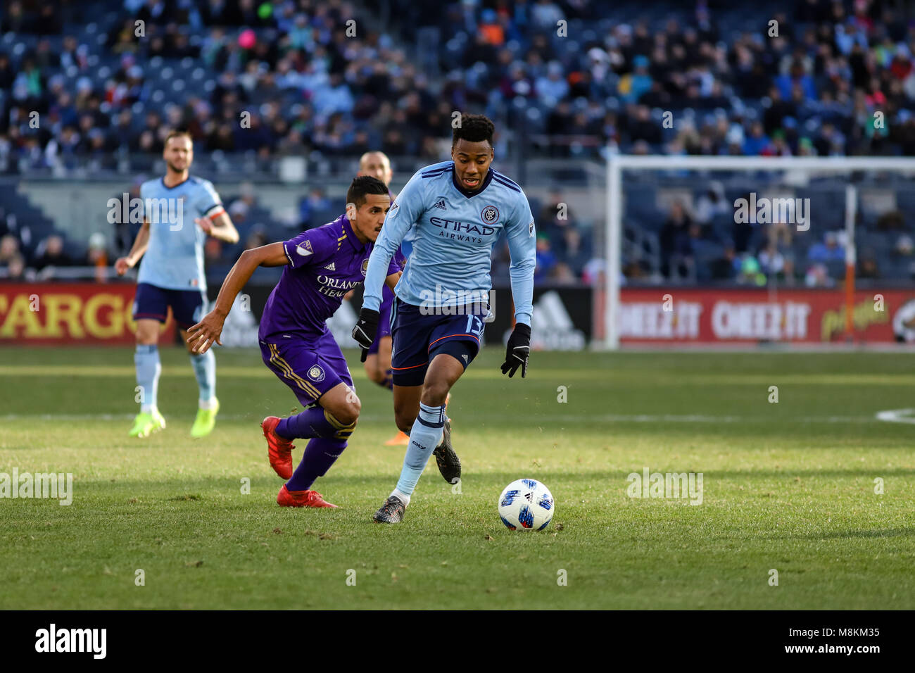 NYCFC vs Orlando City SC action at Yankee Stadium on 17th March 2018. NYCFC won 2-0. Saad Abdul-Salaam (13) dribbles up the pitch. Stock Photo