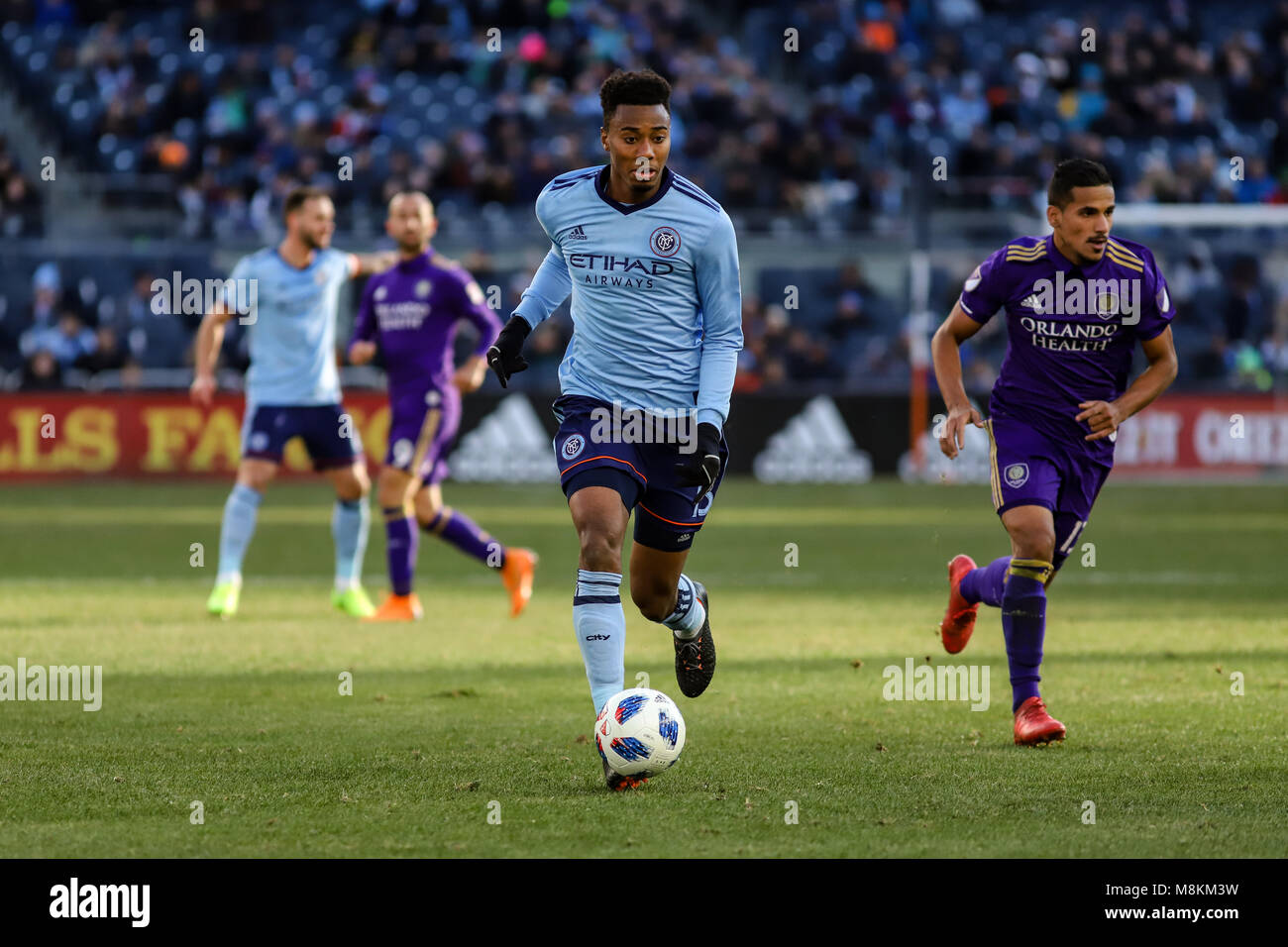 NYCFC vs Orlando City SC action at Yankee Stadium on 17th March 2018. NYCFC won 2-0. Saad Abdul-Salaam (13) dribbles up the pitch. Stock Photo