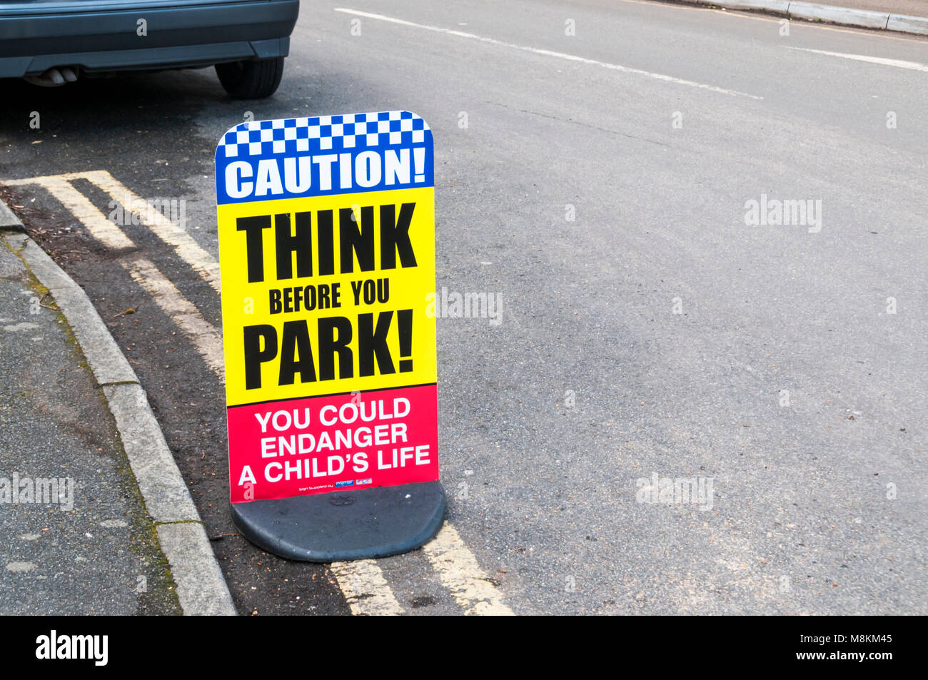 Caution Think Before You Park road safety sign Stock Photo