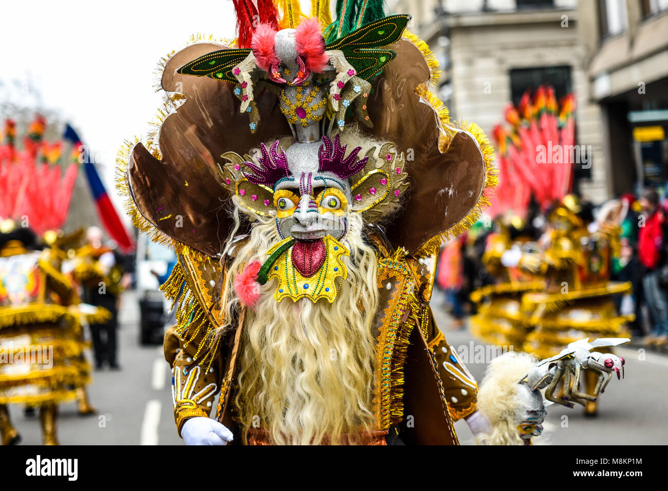 Morenada Bloque Kantuta Bolivian folk group extravagantly dressed dancers in the St. Patrick's Day Parade London 2018. Elaborate mask Stock Photo