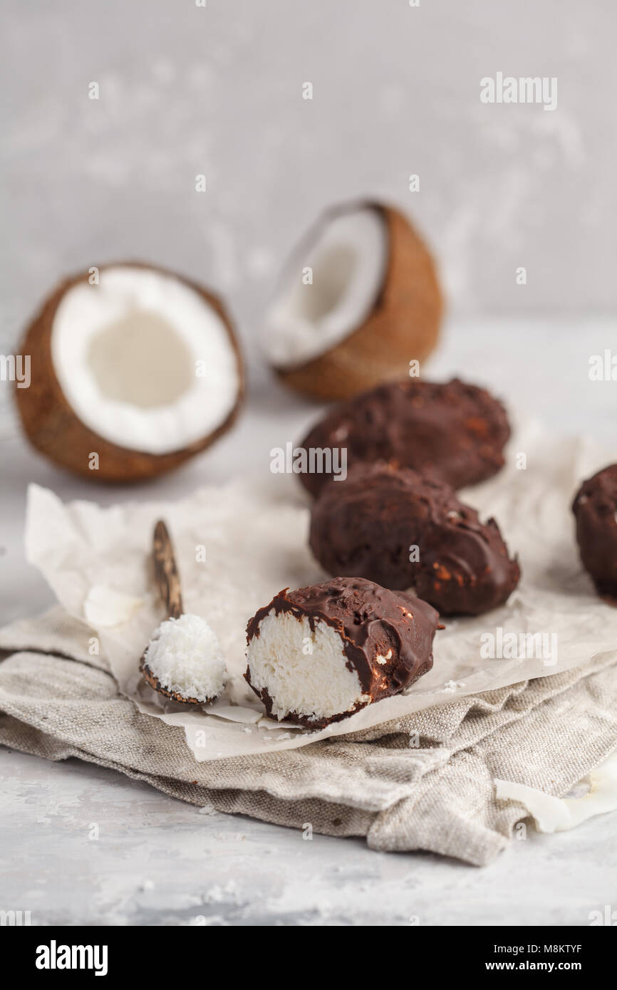 Raw homemade vegan chocolate coconut dessert bounty. Healthy vegan food concept. Stock Photo