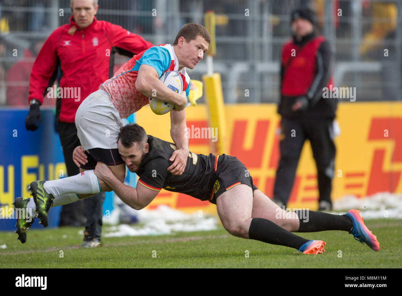 18 March 2018, Germany, Cologne: Match 5 of the Rugby Europe Championship 2018. Germany's Florian Wehrspann (14) tackles Russia's Mikhail Babaev (14) just in front of the German try line. -NO WIRE SERVICE- Photo: Jürgen Keßler/dpa Stock Photo