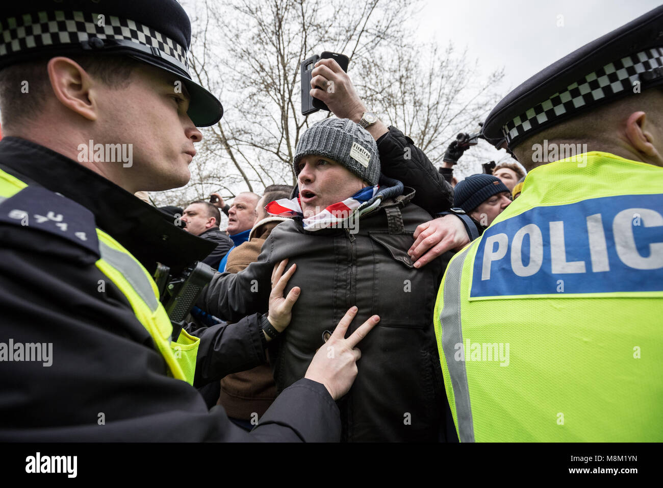 London, UK. 18th March, 2018. Hundreds gather at Speakers’ Corner, Hyde Park waiting to hear a speech written by Generation Identity’s Martin Sellner, delivered by former EDL leader Tommy Robinson. Credit: Guy Corbishley/Alamy Live News Stock Photo